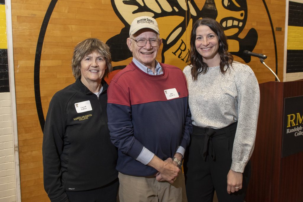 Carroll LaHaye, Billy Wood, and Lindsey Burke-Eberhart pose together at a Back to the Hive event