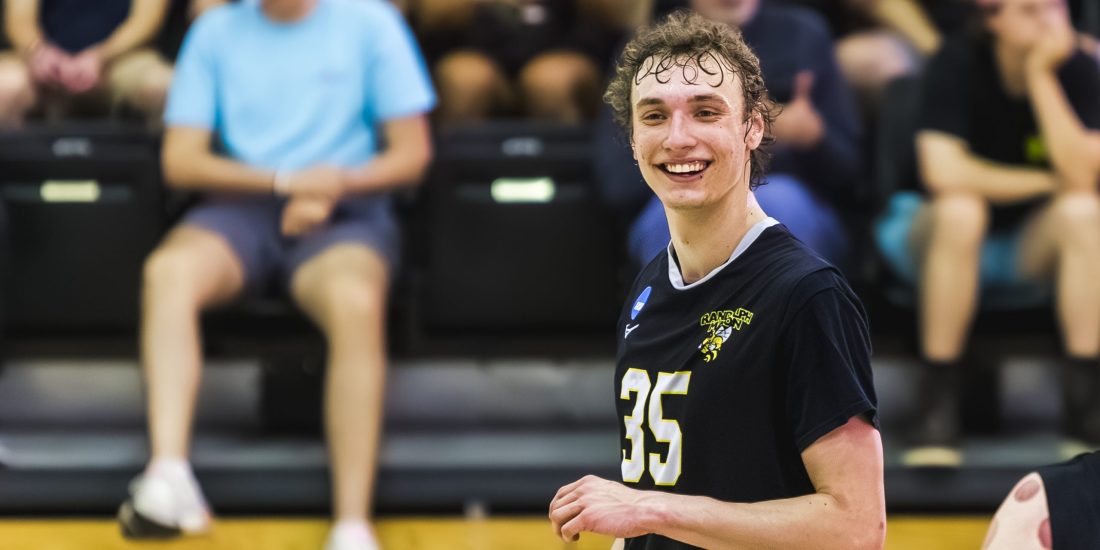 RMC Men's Volleyball player Bryce Matthews smiles between points during a match at Crenshaw Gymnasium
