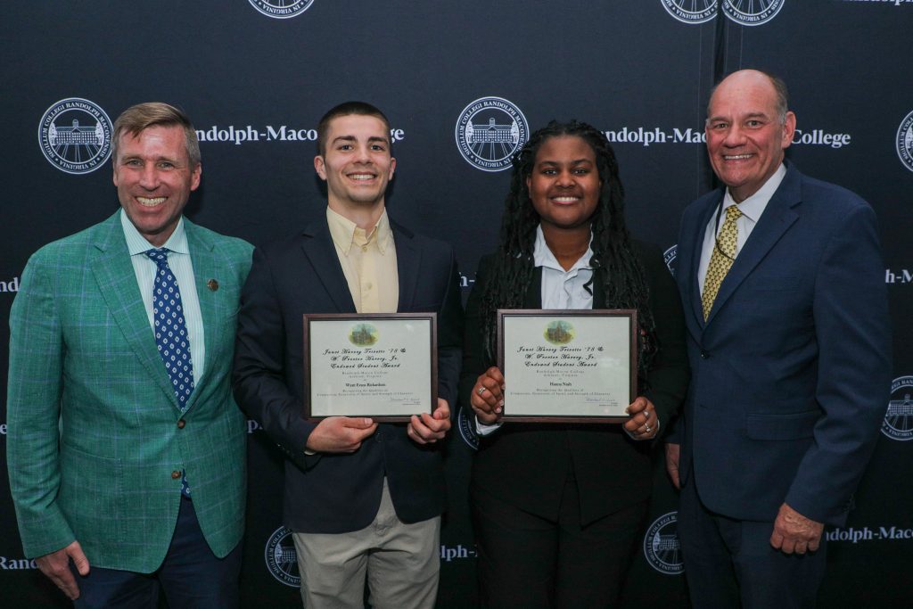 Wyatt Richardson and Hanna Nash stand with President Hill and Dean Azdell holding award plaques