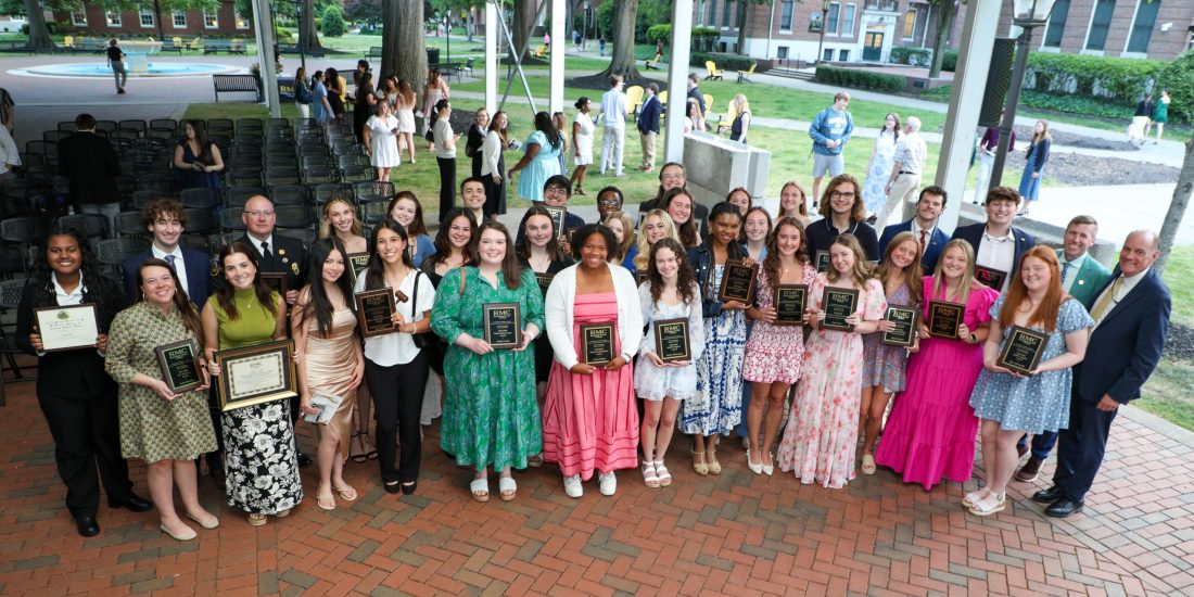 The awardees from the 2026 ODK and Fraternity and Sorority Awards ceremony gather on Fountain Plaza and hold their plaques.