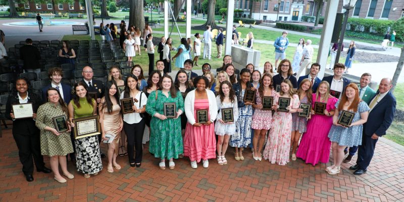 The awardees from the 2026 ODK and Fraternity and Sorority Awards ceremony gather on Fountain Plaza and hold their plaques.