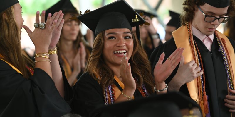 Graduates cheer in celebration during the 2026 Commencement ceremony