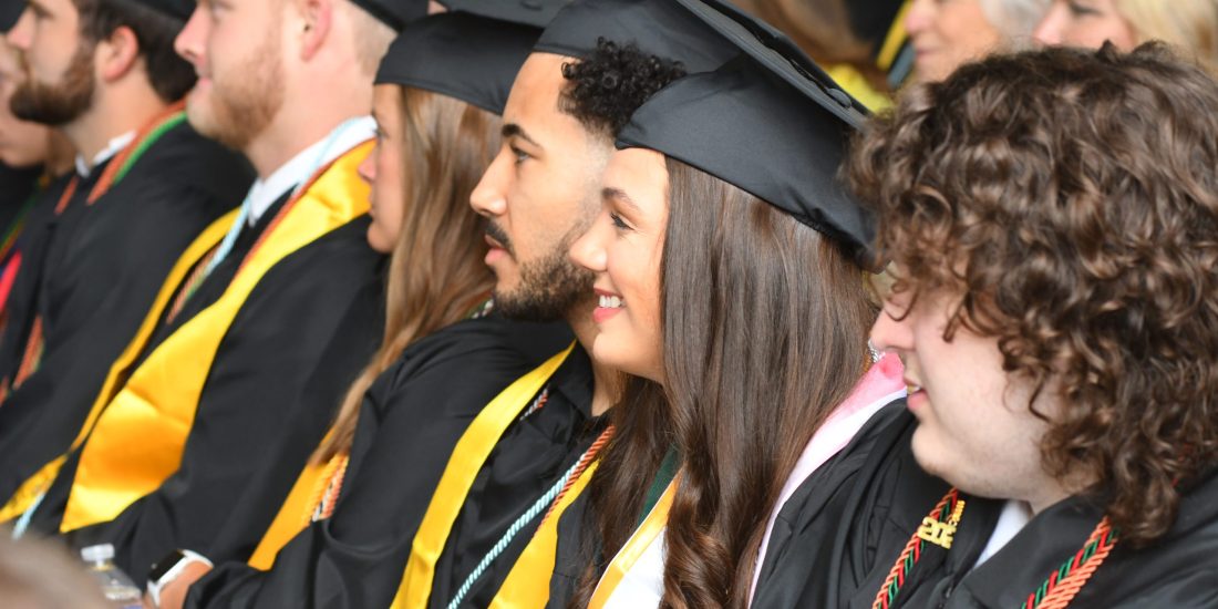 Students in regalia seated during the 2026 Commencement ceremony