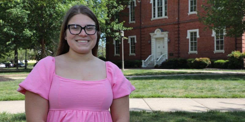 Headshot of Sydney Waldrop in front of Washington-Franklin Hall