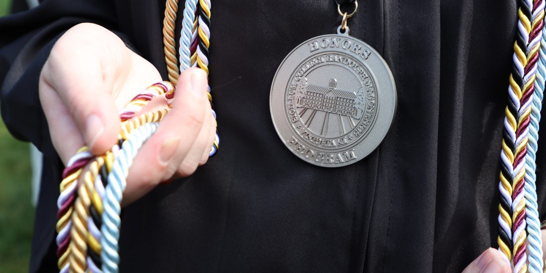 A close-up image of an RMC Honors Program medal.