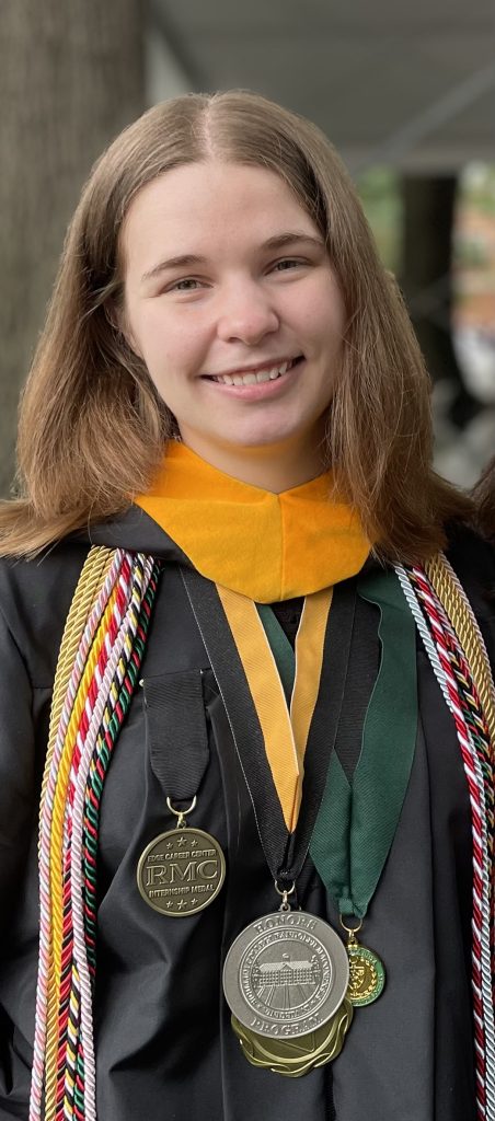 A headshot of Madeline Smith wearing graduation regalia