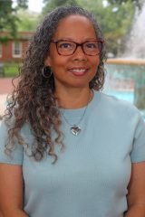 Headshot of Marcelle Davis in front of the fountain