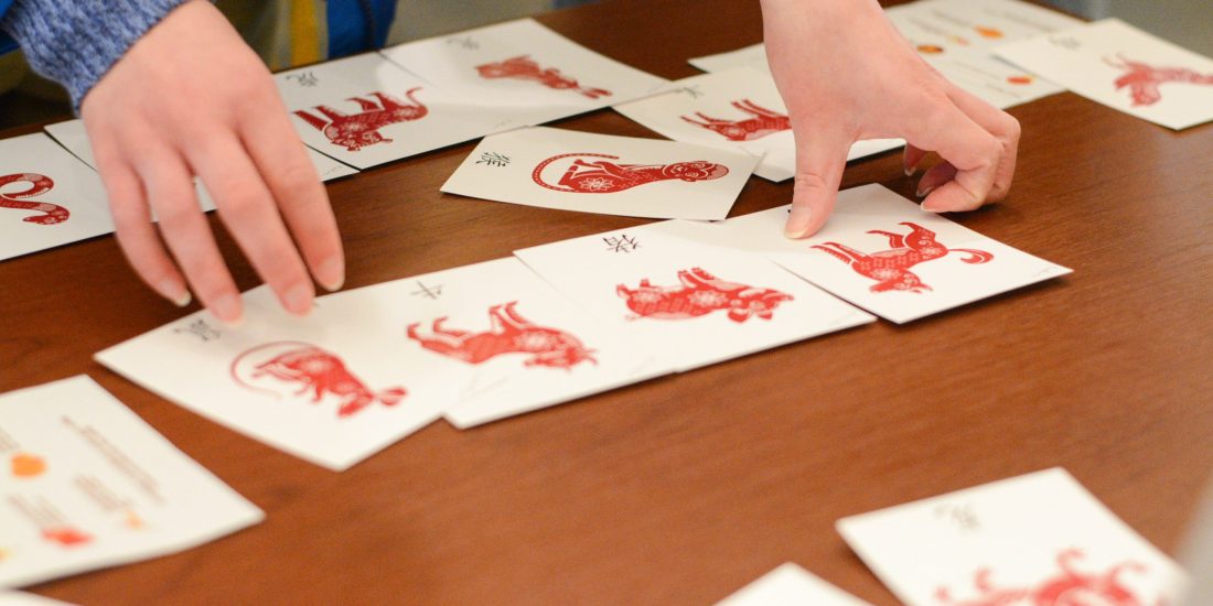 A tight shot of hands and Chinese symbols