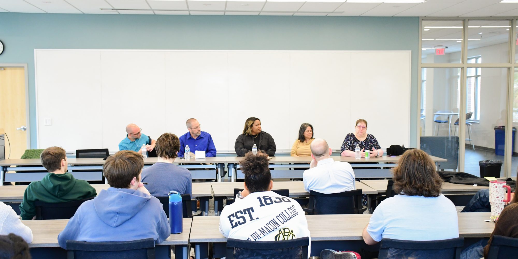 A panel discussion in a classroom