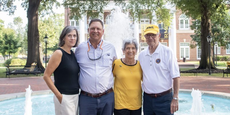 Dillard family portrait around the fountain in front of Brock Commons