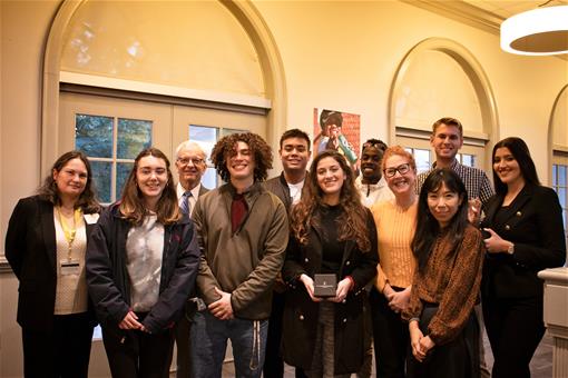 A group of UWC Scholars pose with their honorary globes