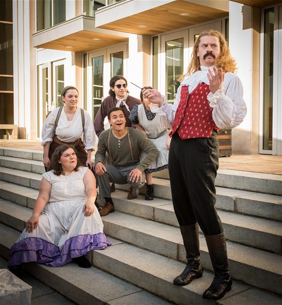 Theatre students performing on steps in front of Blackwell.