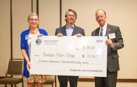 Rich Meagher stands with representatives of the Virginia Law Foundation holding a check for $14,569 made out to Randolph-Macon College